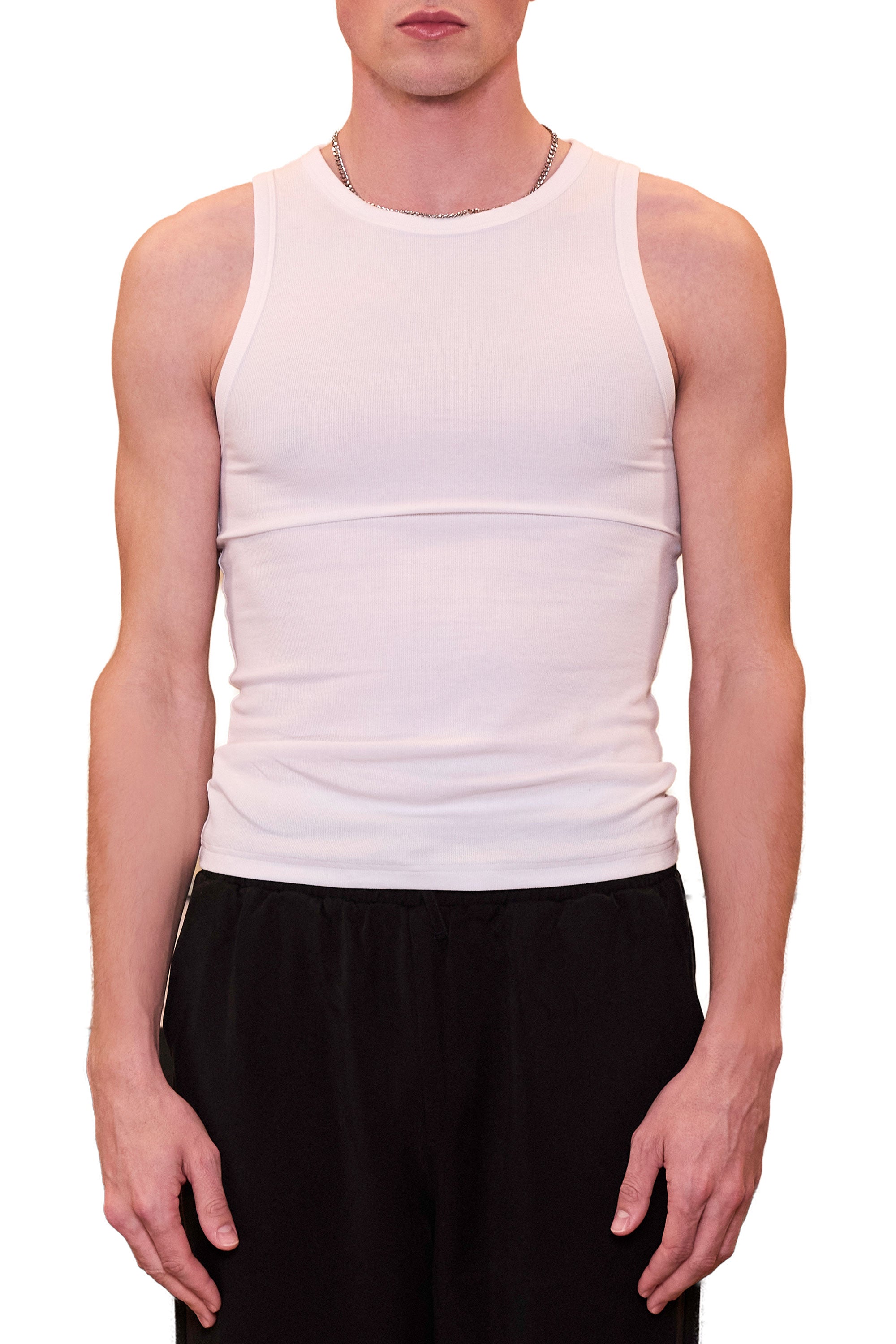 Person wearing a white tank top and black pants on a white background